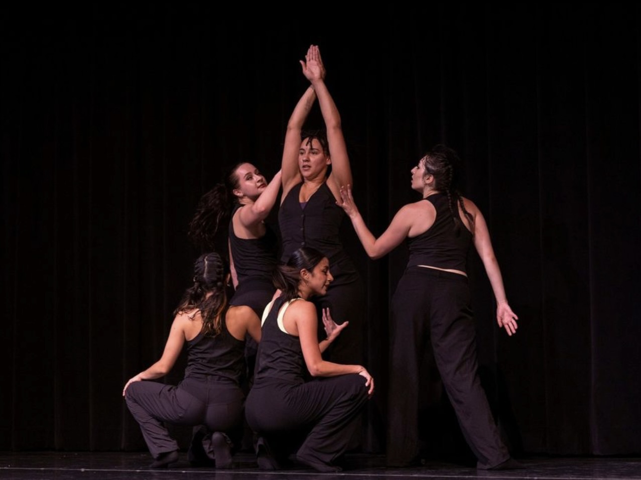 dancers surround main dancer
